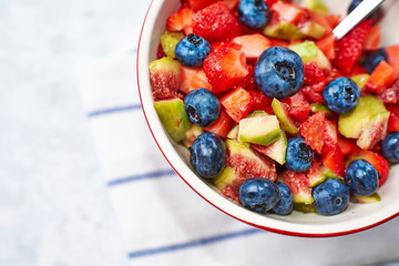 fig strawberry blueberry fruit salad, concept diet and healthy eating