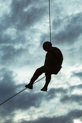 Special Forces descends the rope at a military airfield