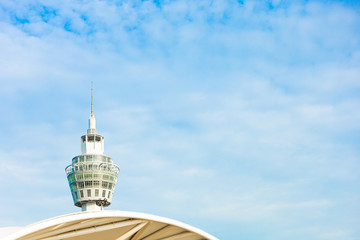 The observation tower is above the bright blue sky with white clouds around, Feeling lonely nobody....