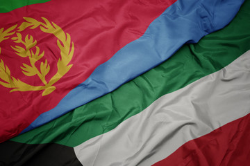 waving colorful flag of kuwait and national flag of eritrea.