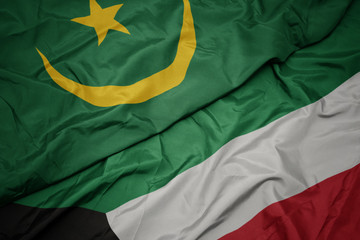 Obraz premium waving colorful flag of kuwait and national flag of mauritania.
