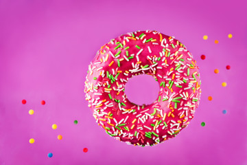 Flying multicolored Donuts with sprinkles