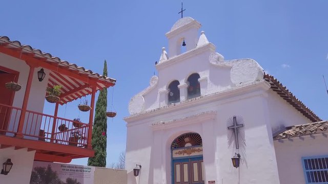 Slow sliding opening shot of church in Pueblito Paisa, Cerro Nutibara, Medellin