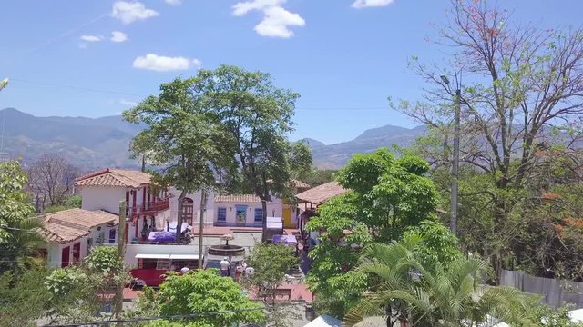 Slow panorama shot of plaza in Pueblo Paisa in summer day