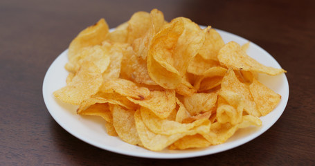 Potato chip on white plate
