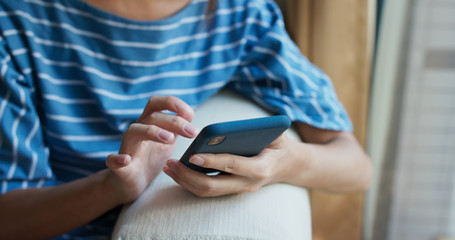 Woman use of mobile phone online