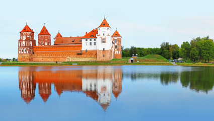 Naklejka na ściany i meble Mir, Belarus. Mir castle complex, reflection in water. Architectural ensemble, cultural monument. Famous landmark, panoramic view