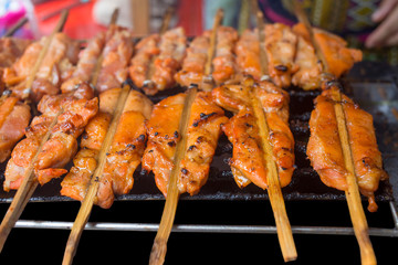 Grilled chicken in the street food, focus selective
