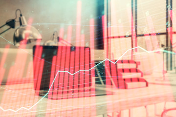 Forex graph hologram with desktop office computer background. Double exposure. Concept of financial...
