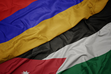 waving colorful flag of jordan and national flag of armenia.