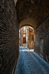 Fototapeta na wymiar Jesi. Italy - Marche- narrow alley in the historic center of the city.