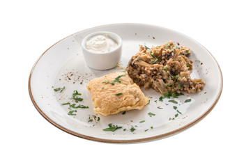 deep fried fish fillet in batter with buckwheat with mushroom and white sauce isolated on white background