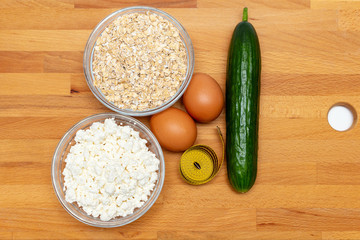 cereals, measuring tape, farm cottage cheese eggs carrot close up on white background protein healthy diet fat free concept eco product sports nutrition