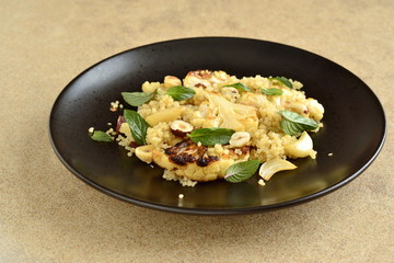 Baked cauliflower, quinoa and hazelnut salad,  copy space