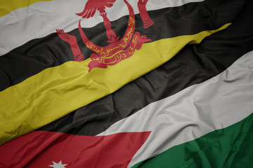 waving colorful flag of jordan and national flag of brunei.