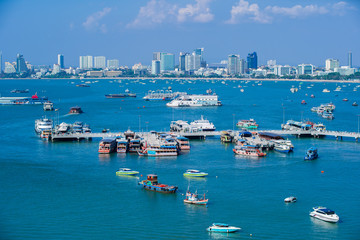 PATTAYA, Thailand - March 13 2019 : Pattaya City and text on hill ,Bali Hai Pier.Is an outstanding tourist attraction in Thailand. Many marinas Beautiful sea and blue sky