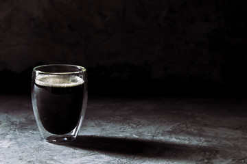 Espresso coffee in shot glass sepia tone with soft shutter