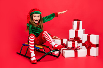 Portrait of nice attractive cheerful cheery glad positive pre-teen elf Santa Claus look outfit...