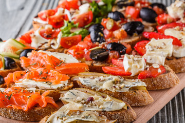 Assorted bruschetta Set of various appetizing snacks sandwiches