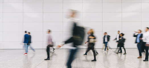large Crowd of anonymous people walking on a trade fair, banner size