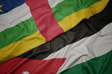 waving colorful flag of jordan and national flag of central african republic.