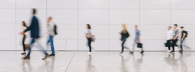 Crowd of people walking on a street in new york