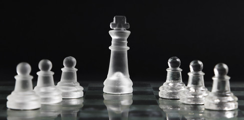 Transparent chess pieces on board