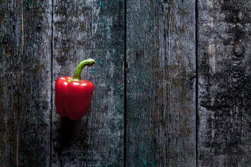 Red bell pepper background on the wooden background