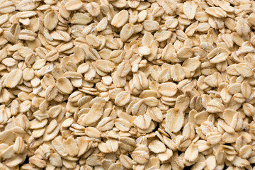 Background of oatmeal. Oat flakes, flat view.