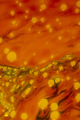 Orange background with golden camera dust