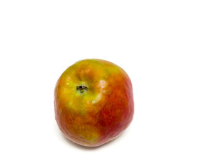 Close-up of one apple named Holsteiner Cox isolated on white.