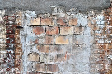 Detailed view on a weathered brick wall texture in high resolution close up