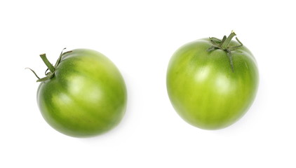 Green unripe tomatoes isolated on white background, top view