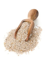 White whole, organic chia seeds heap in brown wooden scoop over white background