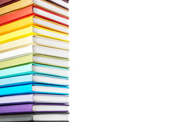 Books with Colorful Book Covers Stacked in a Pile, Isolated on White Background. Bright Education or Business Template with Copy Space