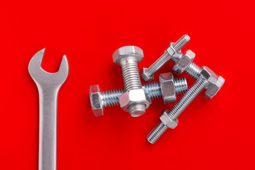A bunch of bolts and nuts. Bolts, nuts and wrench. A bunch of bolts and nuts. Bolts, nuts and wrench.