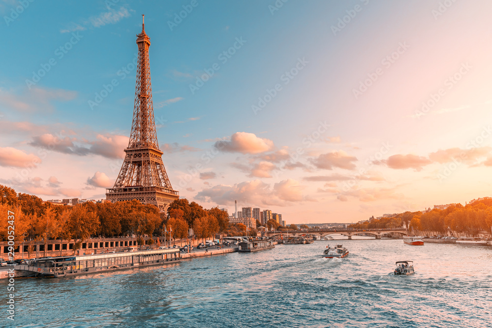 Wall mural the main attraction of paris and all of europe is the eiffel tower in the rays of the setting sun on