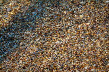 sea pebbles colored granite on the beach