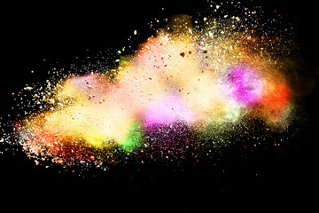 Abstract powder splatted background. Colorful powder explosion on black background. Colored cloud....
