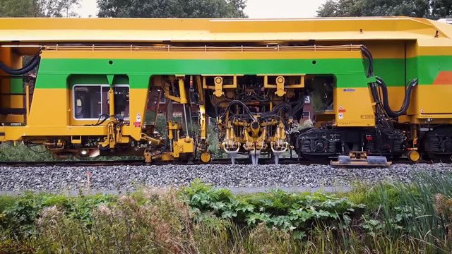 Big Maintenance Train That Looks Like a Caterpillar on a Railway Repairing the Tracks, Dutch City Leeuwarden, Friesland, The Netherlands