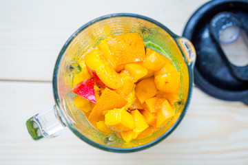 Mixed Spinach with Peach in a Blender, Smoothie Preparation Process, Top View, Free Space for Text