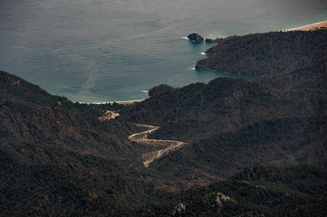 Gorgeous look from the mountain range Tahtali covering with trees on the sea