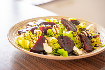 Homemade Healthy Salad with Beetroot, Goat Cheese, Pine Nuts and Balsamic Cream