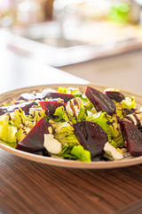 Homemade Healthy Salad with Beetroot, Goat Cheese, Pine Nuts and Balsamic Cream