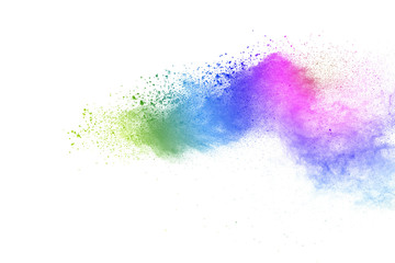 Freeze motion of colorful color powder exploding on white background.  Paint Holi.