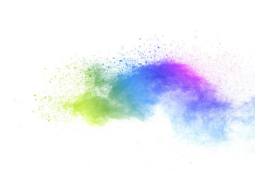 Freeze motion of colorful color powder exploding on white background.  Paint Holi.