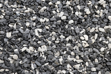 Black and white gravel background. Black and white stone background.