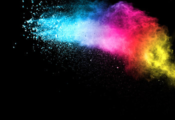 Explosion of colored powder isolated on black background. Abstract colored background. holi...