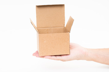 Man hand holding brown paper box on white background