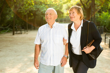 Elderly couple enjoying walk in park